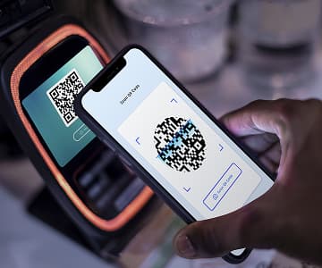 phone making cashless payment by scanning qr code